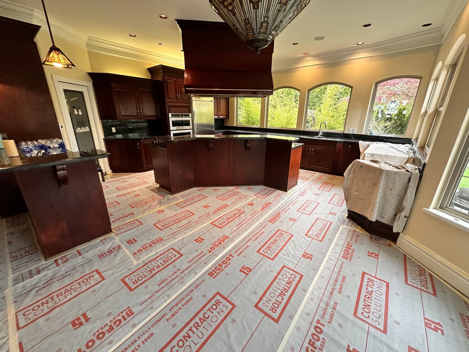 Floor Protection System with multi-layer protection across an interior jobsite